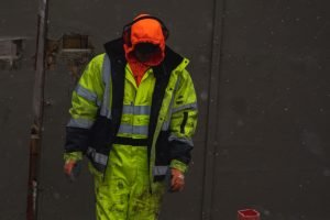 A man dress green workwear
